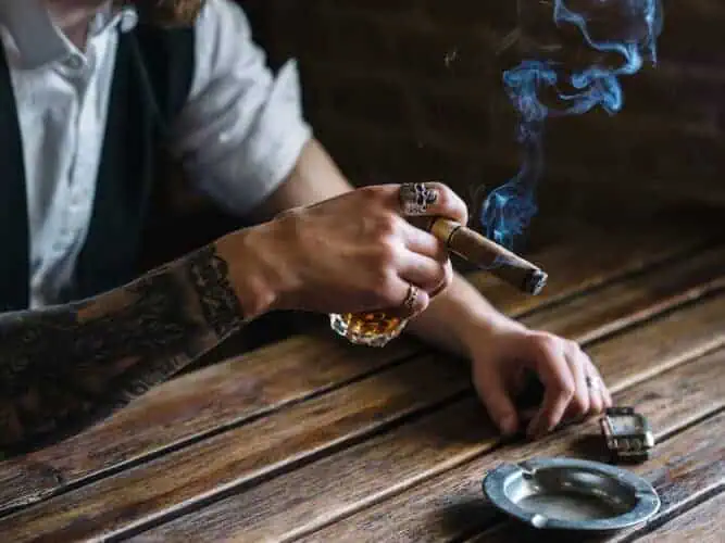 the etiquette a young man smoking cigar