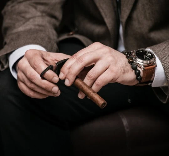 the myths man cutting cigar