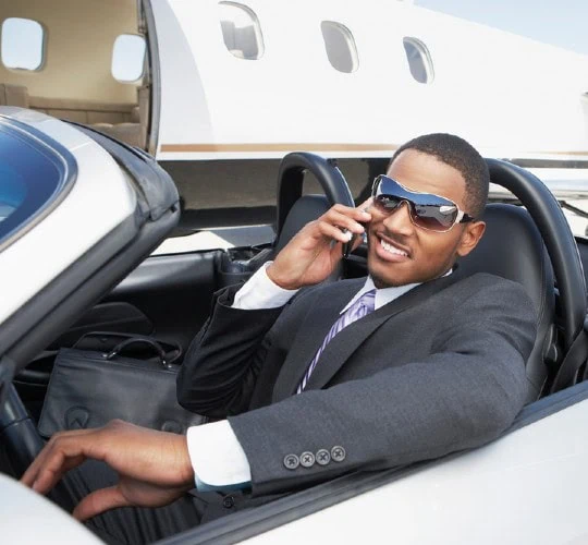 the myths wealthy man in fancy car with private jet